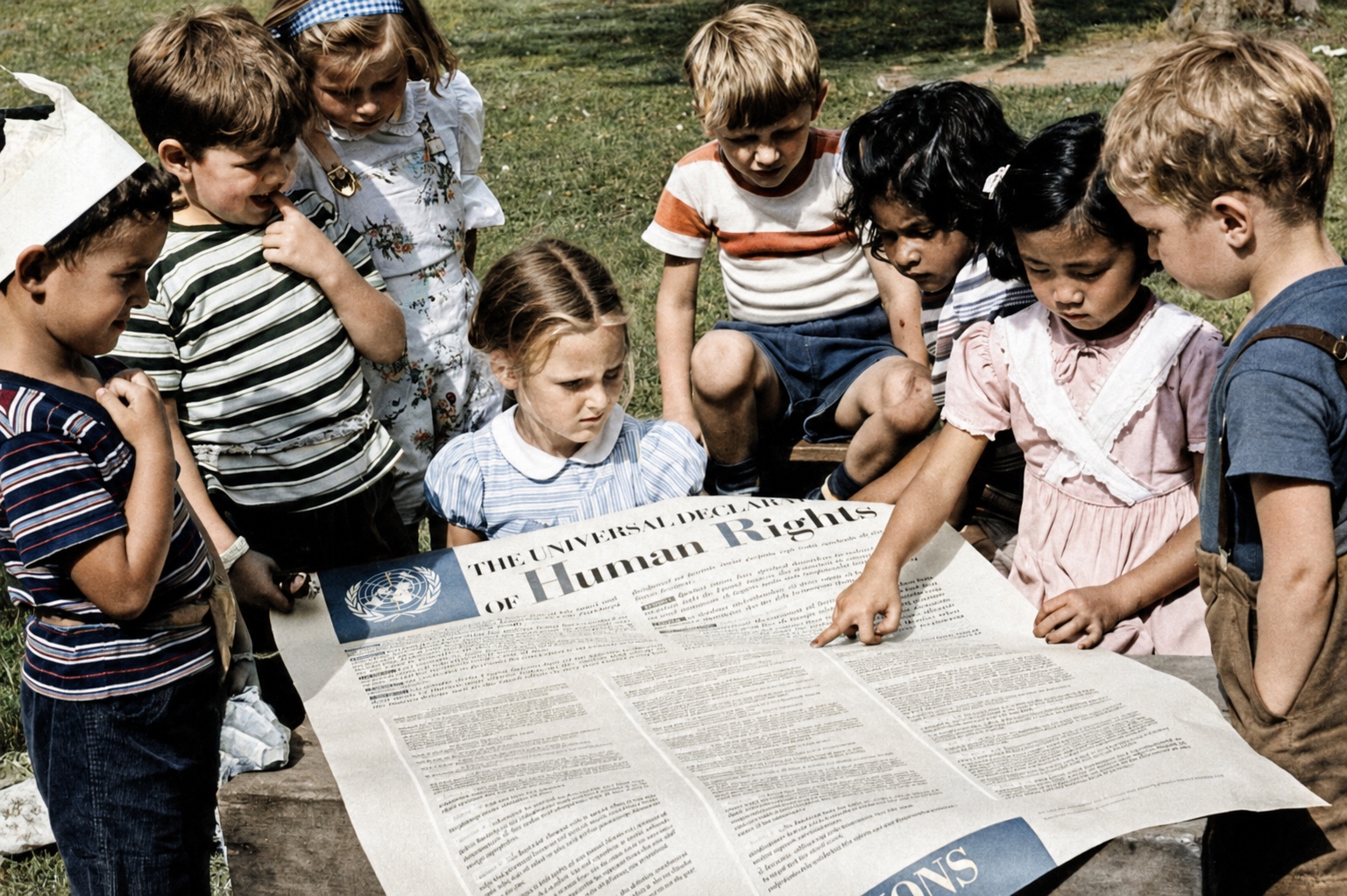 Children reading the Universal Declaration of Human Rights together